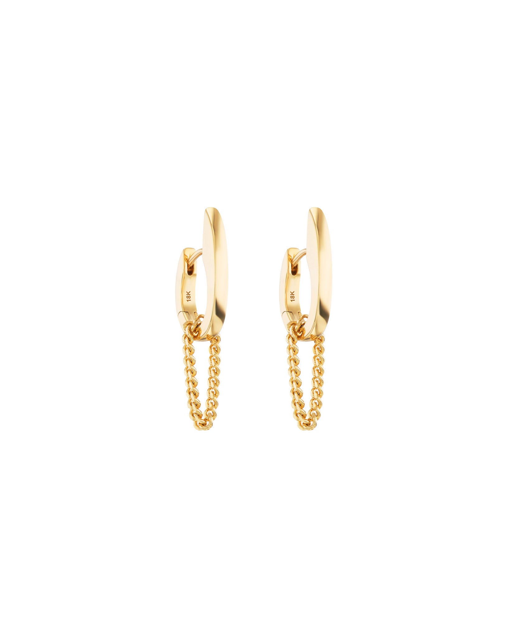 Three quarters view of 18k gold Nuance Huggie Earrings. 